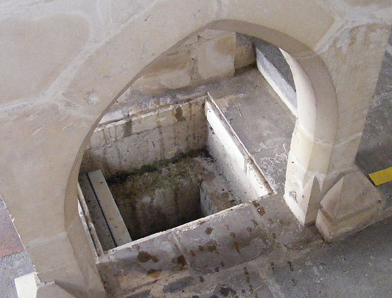 The small cist at the base of the alter