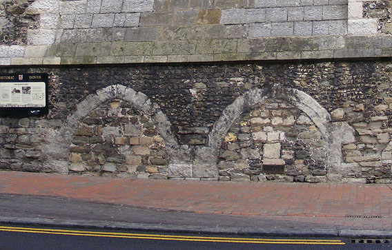 Two filled in doorways on the front of the Maison Dieu